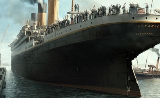 Passengers waving from the top deck in Titanic