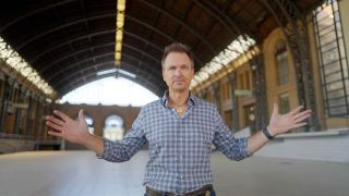 Phil Keoghan in Santiago Chile at an Amazing Race stop looking at camera. 