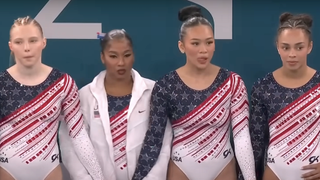 the women's olympic gymnastic team waits on a score during the 2024 paris olympics