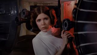 Carrie Fisher's Leia holding blaster at the beginning of A New Hope