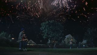 Fireworks going off as the kids play baseball at night in The Sandlot