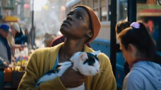 Lupita Nyong'o with her cat on Day 1